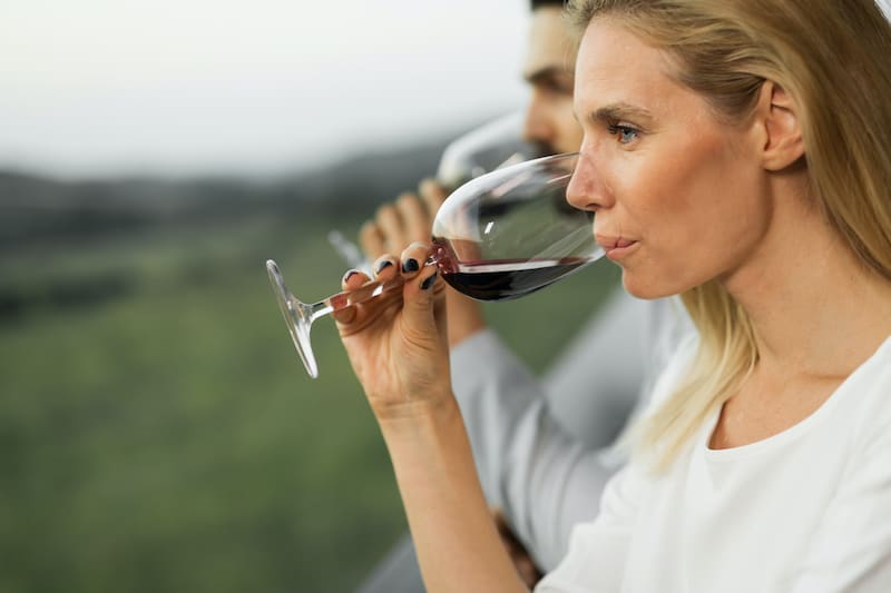 People tasting wine outdoors at wine tasting event